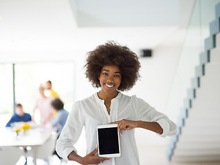 Image showing Portrait of  black casual businesswoman using tablet  with cowor