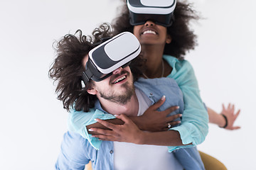 Image showing multiethnic couple getting experience using VR headset glasses