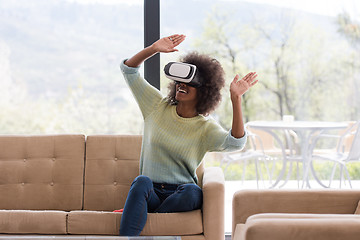 Image showing black woman using VR headset glasses of virtual reality