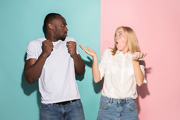 Image showing Beautiful woman and afro woman looking suprised isolated on pink