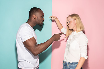 Image showing Man and woman posing at studio during quarrel