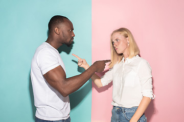 Image showing Man and woman posing at studio during quarrel