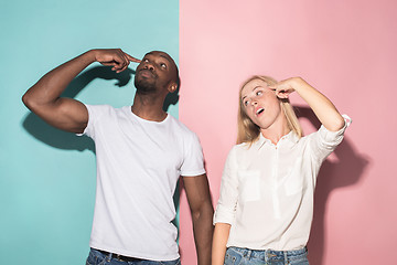 Image showing Man and woman posing at studio during quarrel