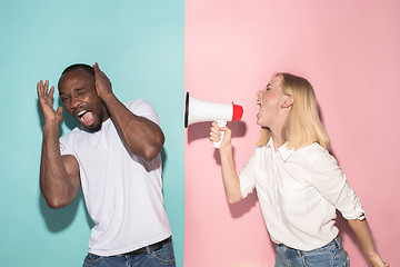 Image showing Man and woman posing at studio during quarrel