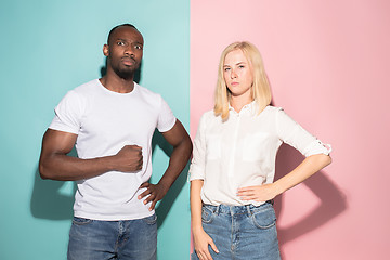 Image showing Portrait of an angry woman looking at camera isolated on a pink background