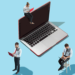 Image showing Flat isometric view of businessmen and woman showing at laptop with empty screen.