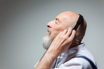 Image showing elderly bald head man with headphones