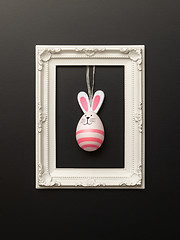 Image showing a happy easter decoration with a bunny egg in a frame