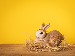 Image showing sweet easter bunny figure yellow background