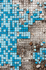 Image showing broken basin with blue small tiles