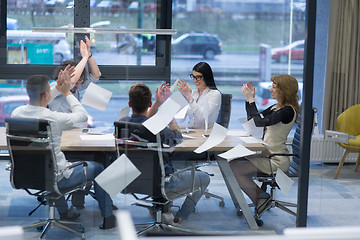 Image showing startup Group of young business people throwing documents