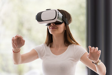 Image showing woman using VR-headset glasses of virtual reality