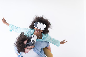 Image showing multiethnic couple getting experience using VR headset glasses