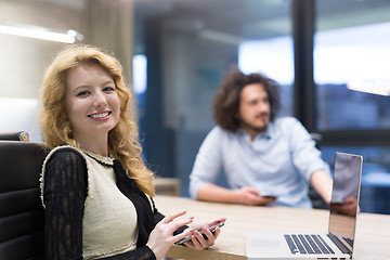 Image showing Elegant Woman Using Mobile Phone in startup office building