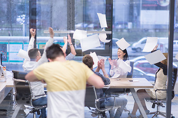 Image showing startup Group of young business people throwing documents