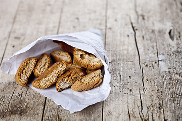 Image showing Traditional Italian cookies cantuccini on white paper bag on ruc