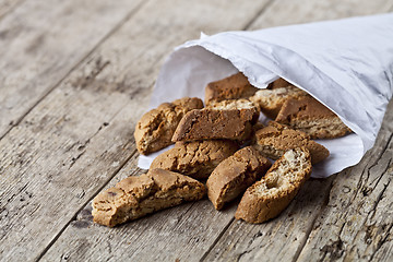 Image showing Traditional Italian cookies cantuccini on white paper bag on ruc