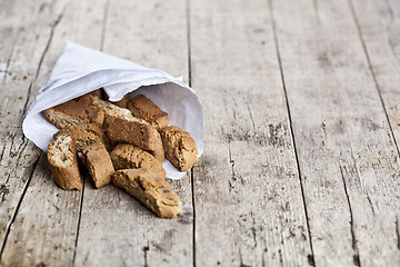 Image showing Traditional Italian cookies cantuccini on white paper bag on ruc