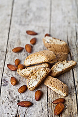 Image showing Fresh homemade Italian cookies cantuccini heap and almond nuts o