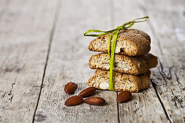 Image showing Fresh Italian cookies cantuccini stack and almond nuts on ructic