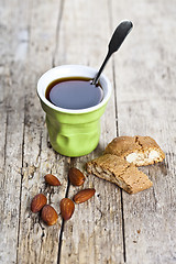 Image showing Cup of coffee, fresh Italian cookies cantuccini and almond nuts 