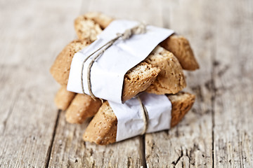 Image showing Traditional Italian cookies cantuccini on white paper on ructic 