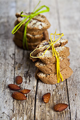 Image showing Fresh Italian cookies cantuccini stackes and almond nuts on ruct