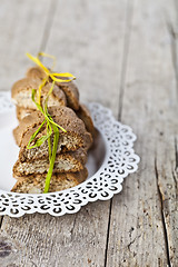 Image showing Fresh homemade Italian cookies cantuccini stacked on white plate