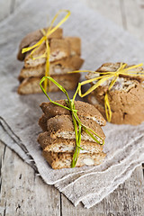 Image showing Fresh Italian cookies cantuccini with almond seeds on linen napk