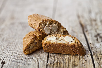 Image showing Homemade Italian cookies cantuccini heap with almond seeds on ru