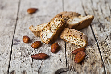 Image showing Fresh homemade Italian cookies cantuccini heap and almond seeds 