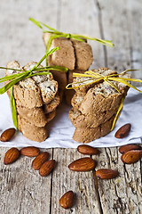 Image showing Fresh Italian cookies cantuccini stacks and organic almond seeds