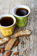 Image showing Two cups of coffee, fresh Italian cookies cantuccini and almond 