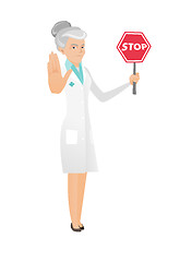 Image showing Senior caucasian doctor holding stop road sign.
