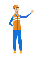 Image showing Young caucasian builder with outstretched hand.