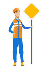 Image showing Young caucasian road worker showing road sign.