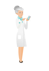 Image showing Senior caucasian doctor holding a mobile phone.