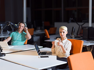 Image showing designers in the night startup office