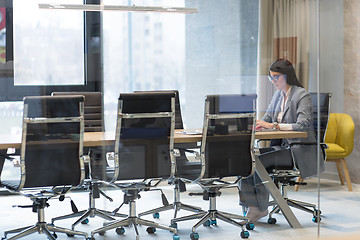 Image showing businesswoman using a laptop in startup office