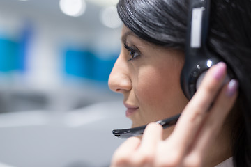 Image showing female call centre operator doing her job