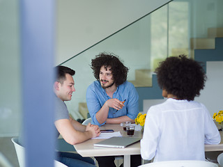 Image showing Multiethnic startup Business Team At A Meeting at modern office 