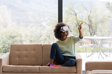 Image showing black woman using VR headset glasses of virtual reality