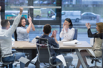 Image showing startup Group of young business people celebrating success