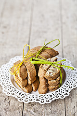 Image showing Fresh Italian cookies cantuccini with almonds stacked on white p
