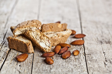 Image showing Fresh homemade Italian cookies cantuccini heap and almond seeds 