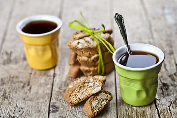 Image showing Two cups of coffee, fresh Italian cookies cantuccini and almond 