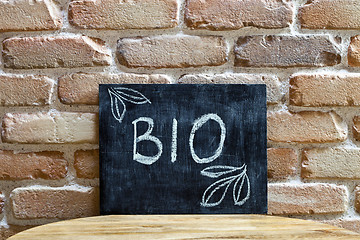 Image showing Chalk board with the word BIO drown by hand and chalks on wooden