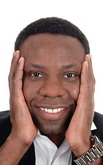 Image showing Happy African man with hands on face