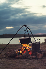 Image showing Preparing food on campfire