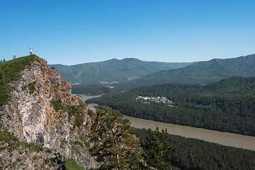 Image showing Man standing on top of cliff